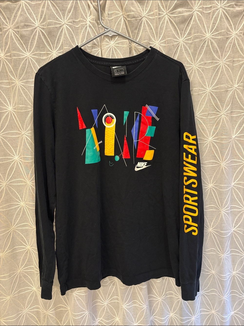 Nike Black Long Sleeve Tee with Multicolor Geometric Logo and Yellow Sleeve Text